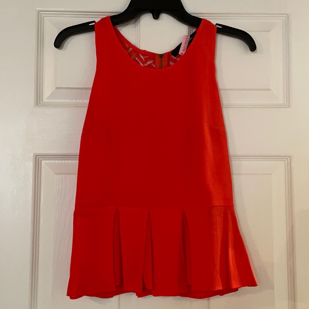 Orange peplum tank with lace detailing